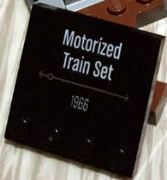 Tile, Modified 4 x 4 with Studs on Edge with 'Motorized Train Set 1966' Pattern: {черен}