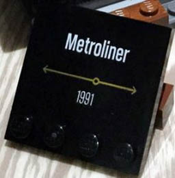 Tile, Modified 4 x 4 with Studs on Edge with 'Metroliner 1991' Pattern: {черен}