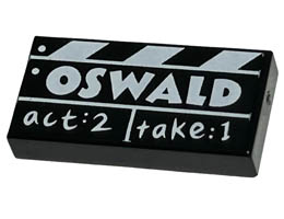 Tile 1 x 2 with Groove with Film Slate with White OSWALD and act:2 take:1 Pattern: {черен}